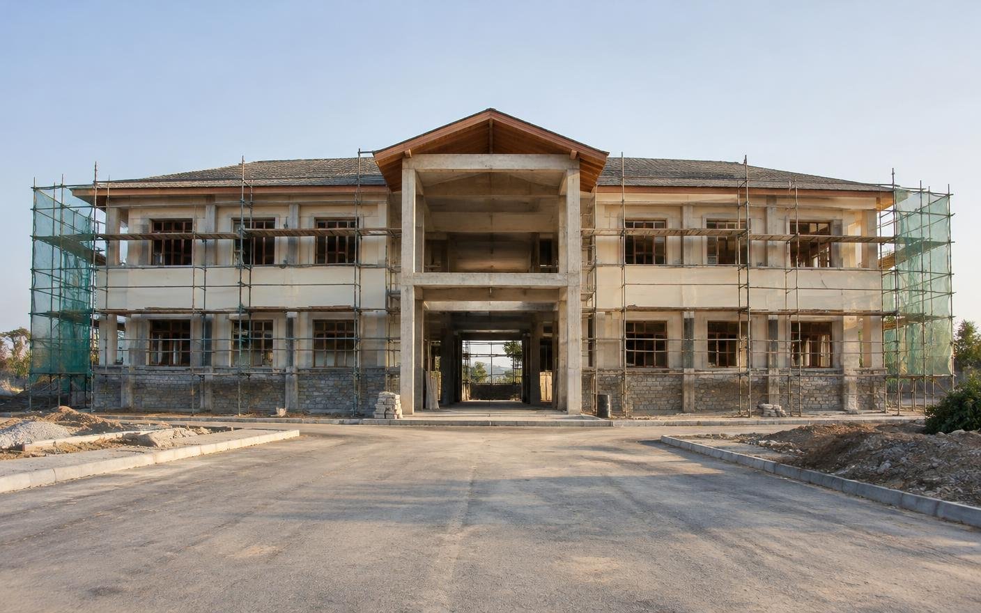 Government institutional building under construction with stone plinth