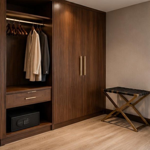 Custom walnut wardrobe joinery with luggage rack